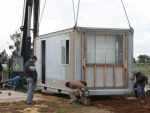 Bottom Pit Box container lowered into position.