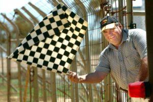 THE PRIZE: Blue Ribbon Raceway assistant pit marshal Robin Thomas waves the Chequered Flag. PHOTO: JEFFERY CHAN 