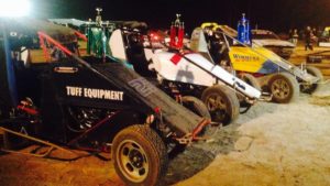 The cars of Jock Baker, Adrian Christian and Adam Mackenzie adorned with the winning trophies.