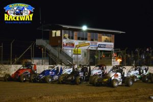 FOUR WIDE WINGLESS: Feature race drivers perform a Four-wide salute to the race fans before the race. PHOTO: Leanne Shanks