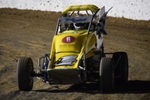 FLAG: Jock Baker in his victory lap after winning the Les McMaster memorial for Limited Sportsman. PHOTO: M&L Speedway Photography.